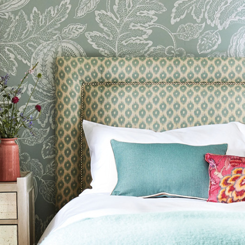 Bed with fabric headboard